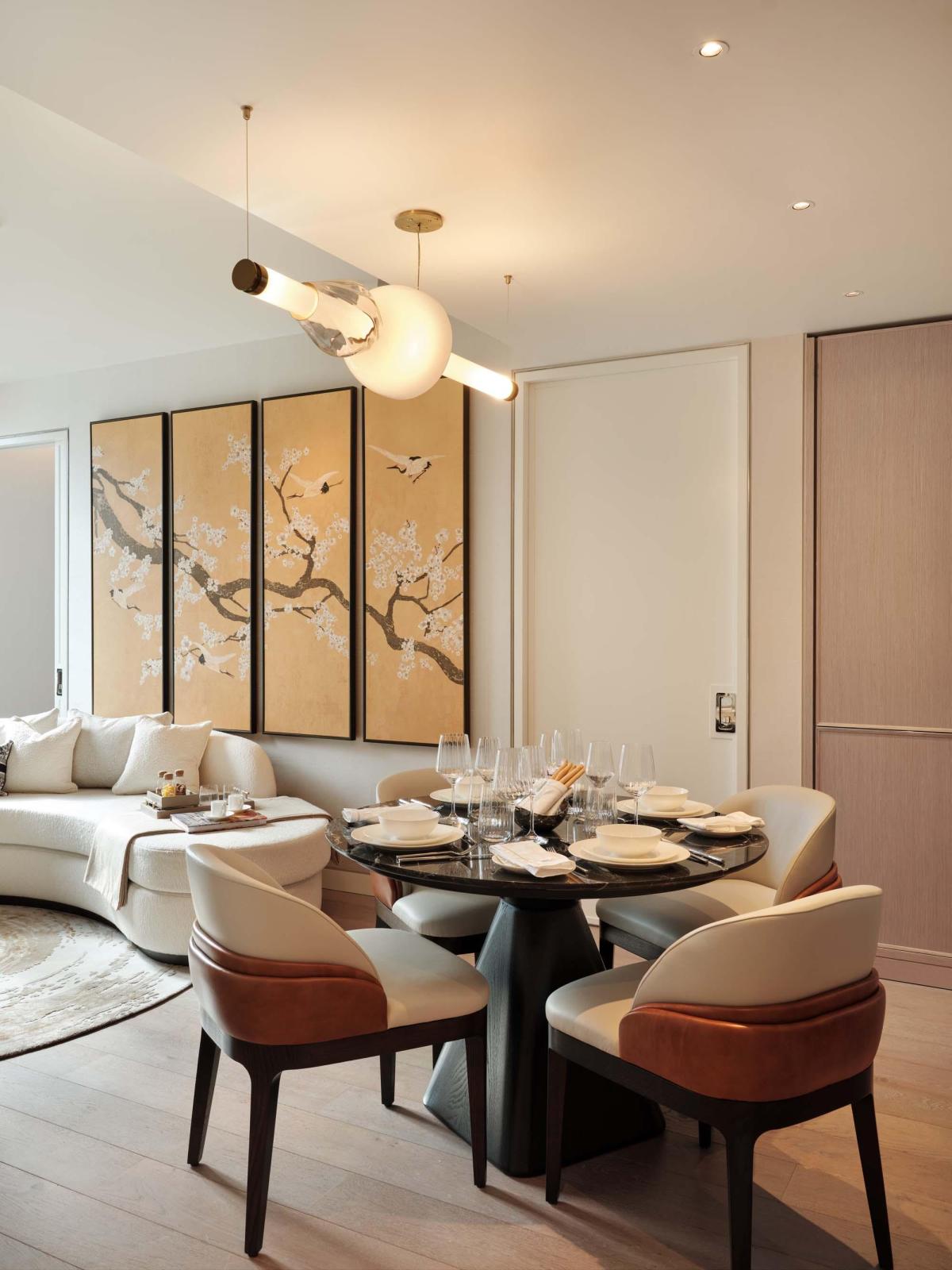 Custom Luna chandelier installation with brass and glass details
