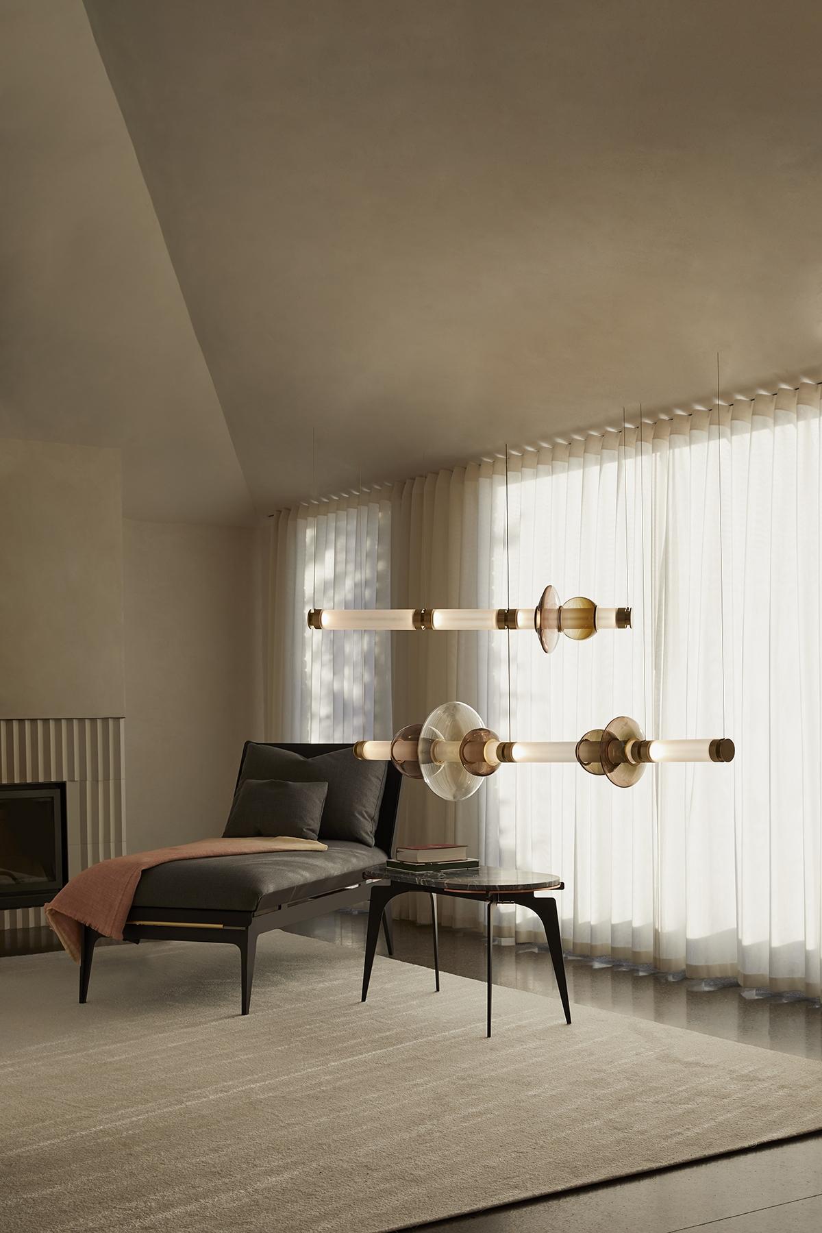 Minimalist black Gabriel Scott Boudoir daybed with Luna glass chandelier creating a cozy corner in modern interior