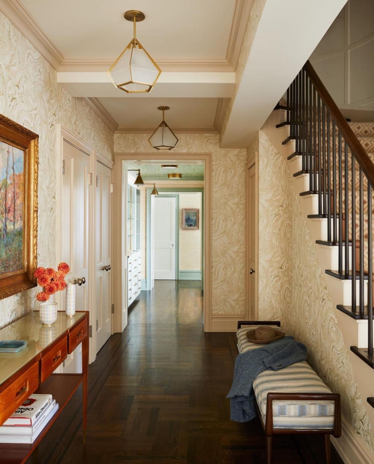 Hallway featuring a series of Harlow pendant lights in a project by interior designer Gideon Mendelson